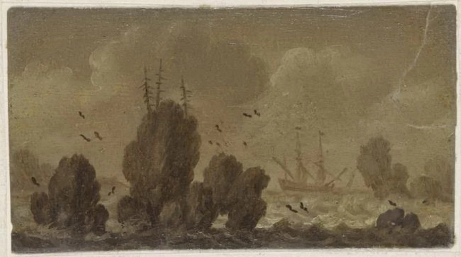 Vista sul mare con veliero tra le rocce